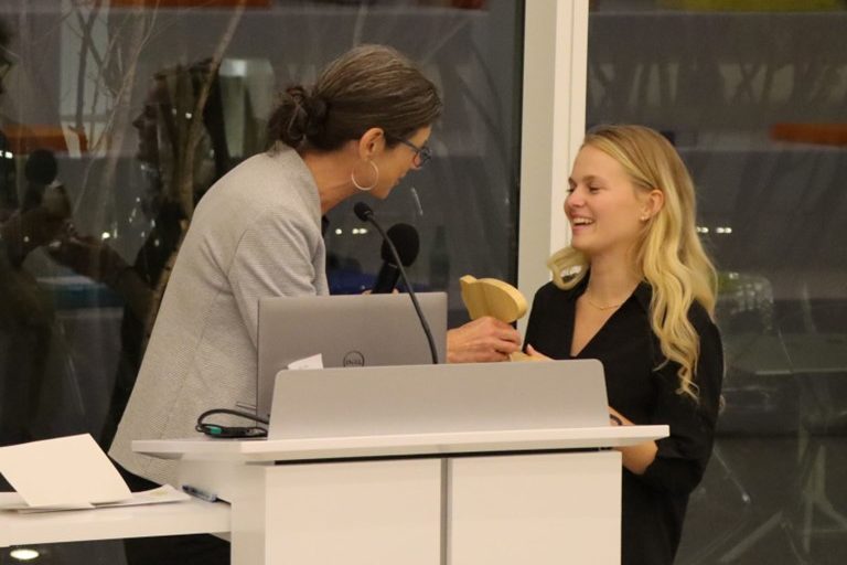 Beth Churchill hands BOOST Audience Favorite Award to Aleksandra Plewa