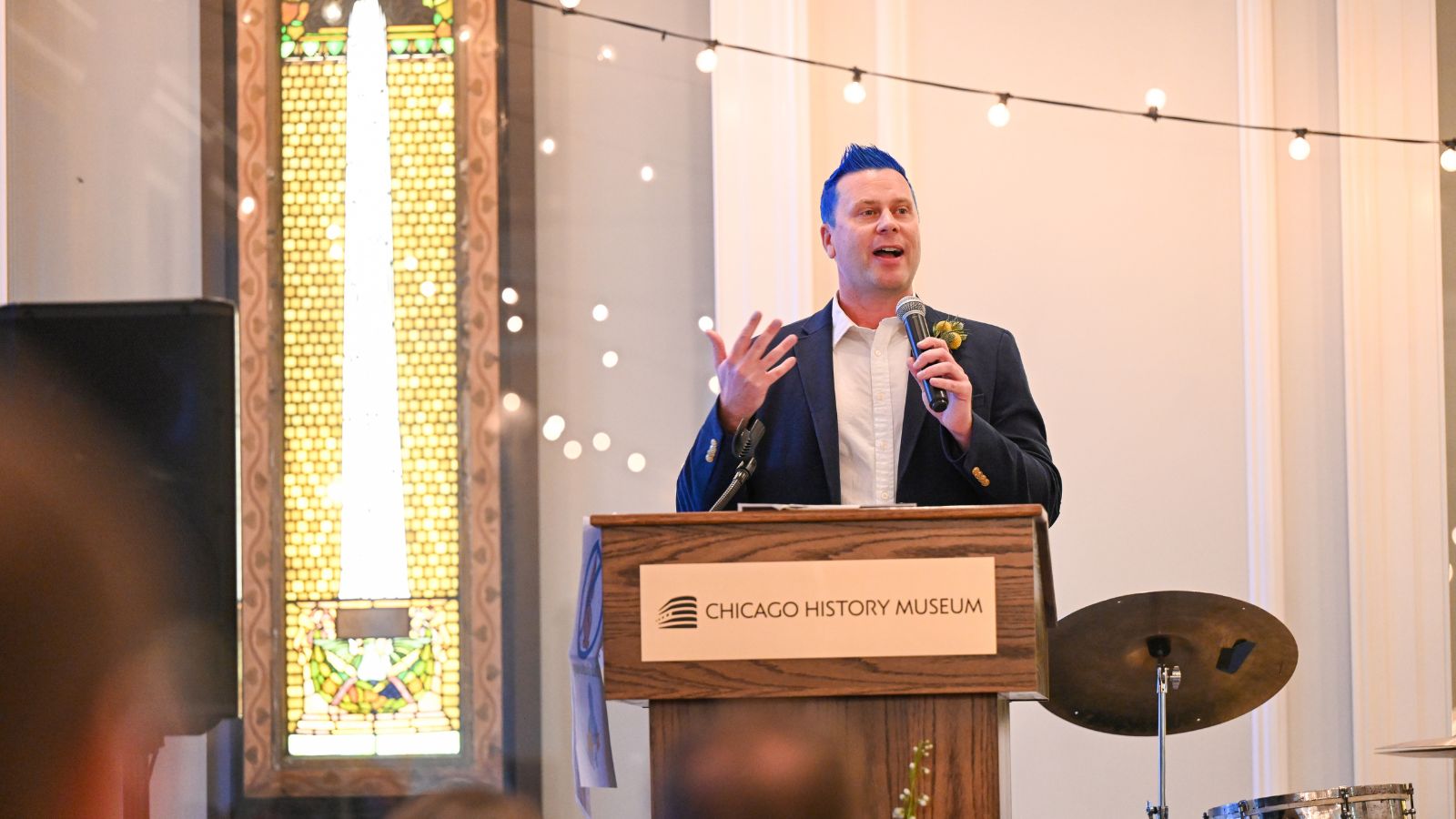 Picture of Bill Schleizer delivering speech from dais at Chicago History Museum