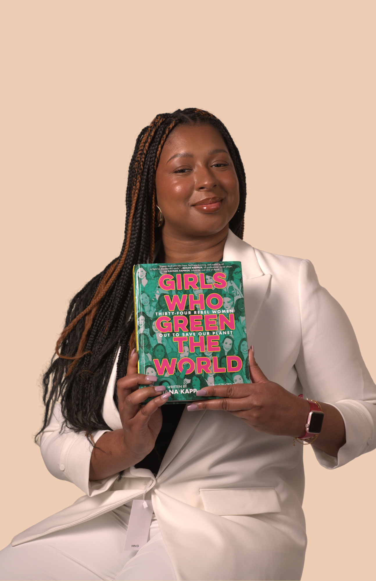 Newson, Jannice Picture of Jannice Newson holding "Girls Who Green the World" book